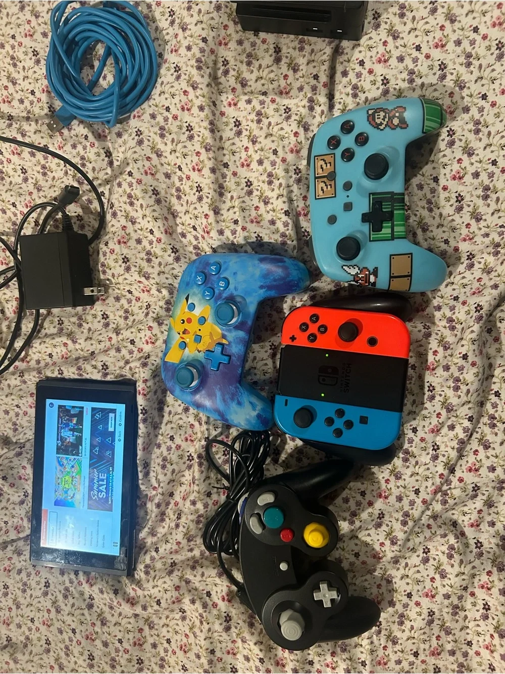 Nintendo Switch with Neon Red/Blue Joy‑Con and Blue Themed Controllers